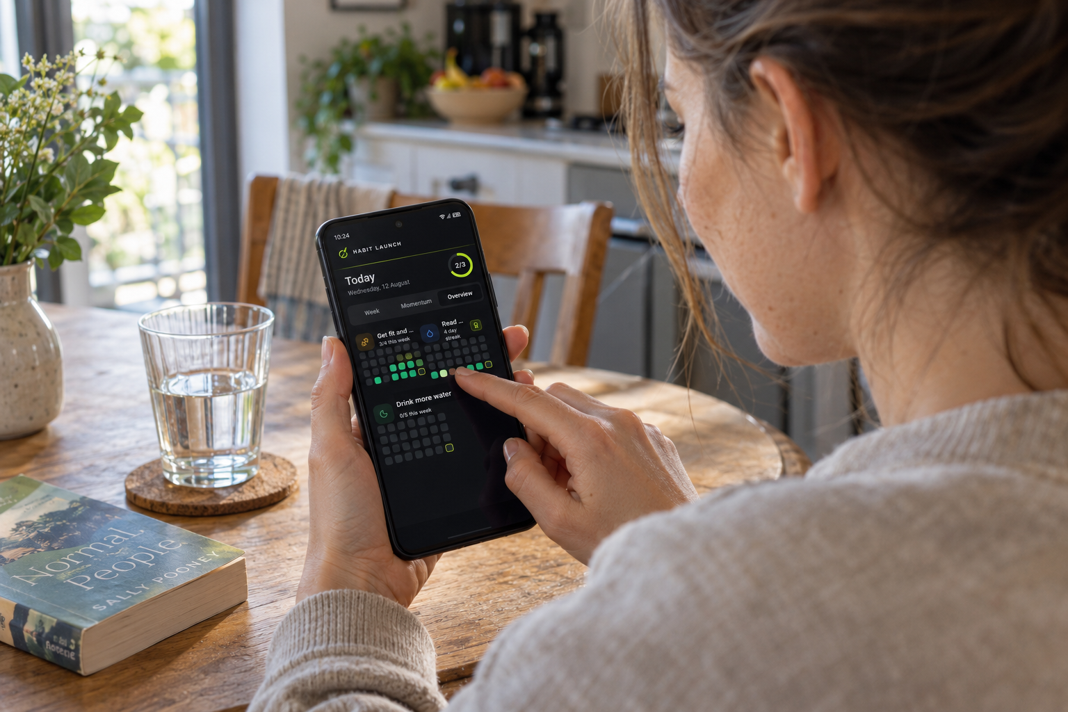 Habit Launch app in use at a kitchen table